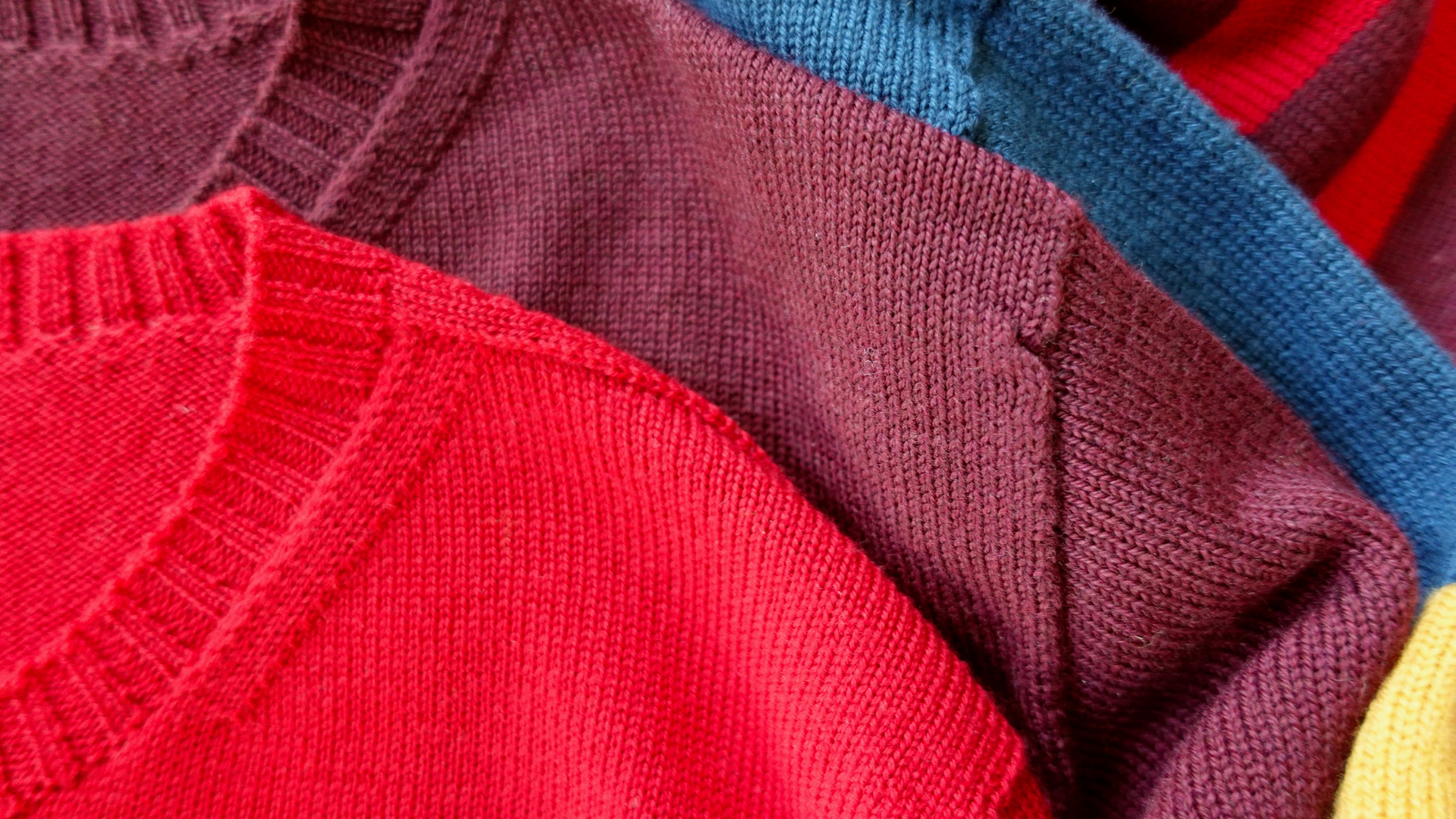 Detail of knit sweaters at the collar